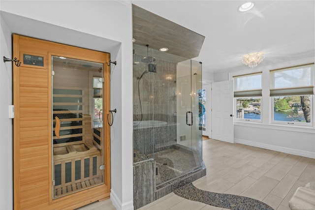 full bath featuring a stall shower, baseboards, wood finished floors, a sauna, and recessed lighting