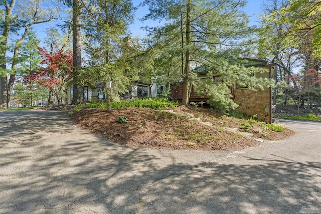 view of property exterior with stone siding