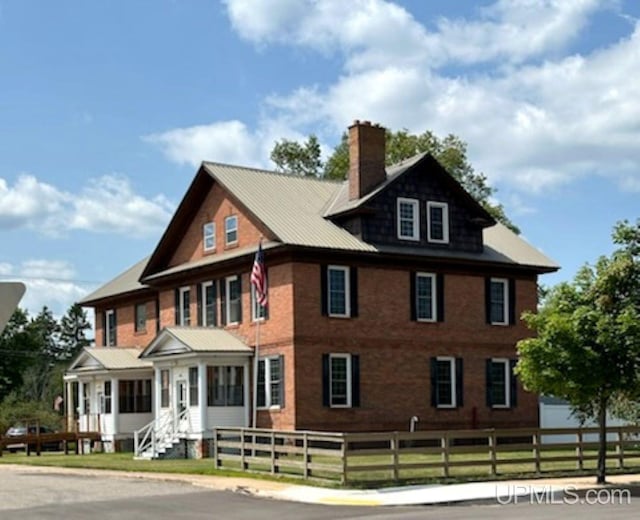258 W Jasper St, Gwinn, MI 49841 - rear view of property with a fenced front yard and a chimney