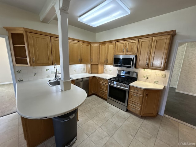 258 W Jasper St, Gwinn, MI 49841 - kitchen with appliances with stainless steel finishes, a sink, light countertops, and brown cabinets