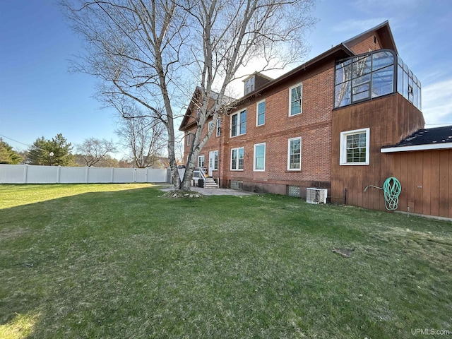 258 W Jasper St, Gwinn, MI 49841 - back of property with central AC and brick siding
