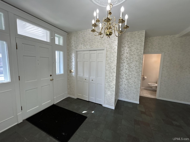 258 W Jasper St, Gwinn, MI 49841 - foyer with wallpapered walls, a chandelier, and baseboards