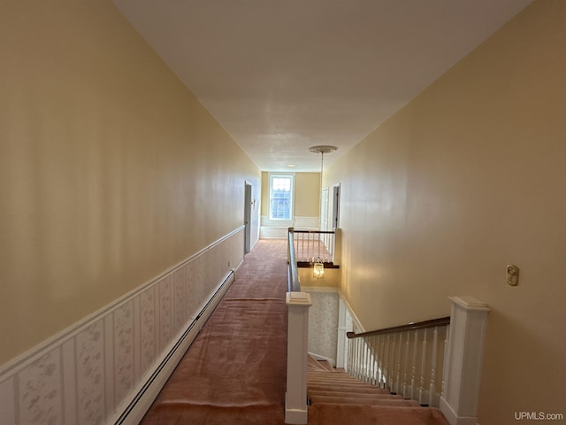 258 W Jasper St, Gwinn, MI 49841 - hallway with an upstairs landing, a baseboard radiator, and carpet floors