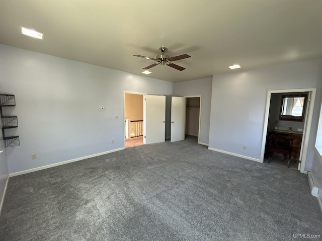 258 W Jasper St, Gwinn, MI 49841 - unfurnished bedroom with carpet, baseboards, connected bathroom, and ceiling fan