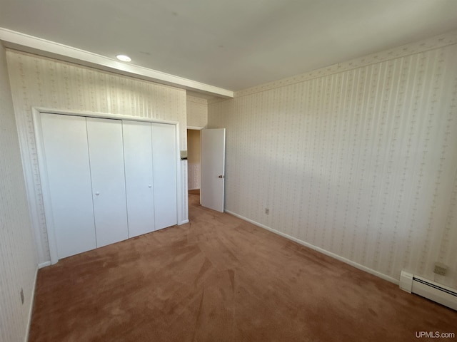 258 W Jasper St, Gwinn, MI 49841 - unfurnished bedroom with baseboard heating, carpet flooring, wallpapered walls, and a closet