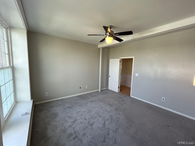 258 W Jasper St, Gwinn, MI 49841 - empty room with plenty of natural light, ceiling fan, carpet flooring, and baseboards