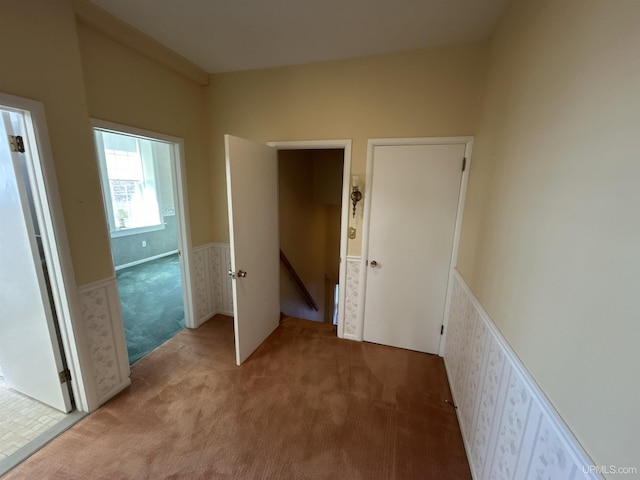 258 W Jasper St, Gwinn, MI 49841 - corridor featuring an upstairs landing, light carpet, and a wainscoted wall