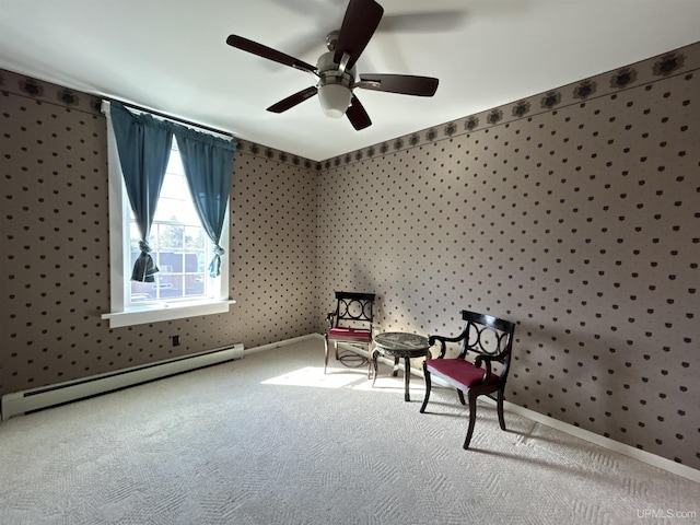 258 W Jasper St, Gwinn, MI 49841 - living area featuring a baseboard radiator, carpet flooring, and a ceiling fan