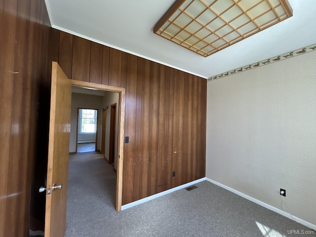 258 W Jasper St, Gwinn, MI 49841 - spare room with carpet, baseboards, and wood walls