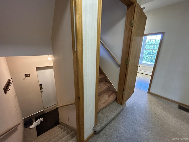258 W Jasper St, Gwinn, MI 49841 - staircase featuring baseboard heating and carpet flooring