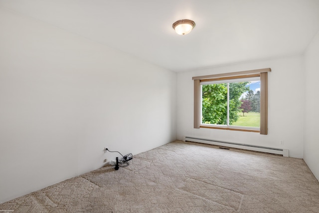carpeted empty room featuring a baseboard radiator