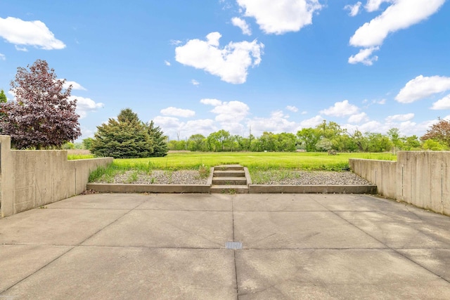 view of patio featuring fence