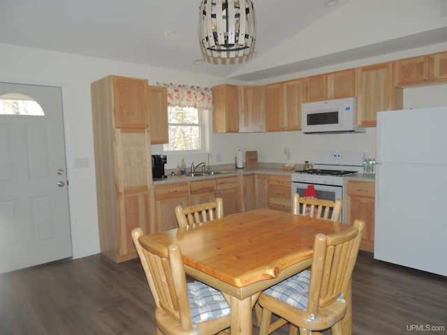 8653 Ll Rd, Rapid River, MI 49878 - kitchen featuring white appliances, light brown cabinetry, a sink, dark wood-style flooring, and vaulted ceiling