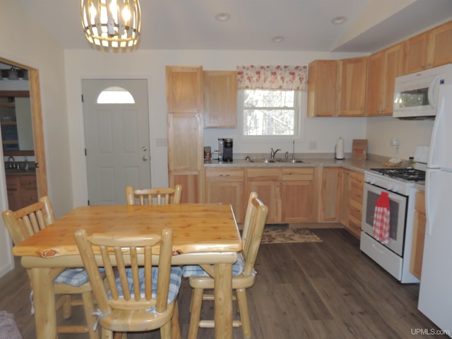 8653 Ll Rd, Rapid River, MI 49878 - kitchen featuring white appliances, a sink, light countertops, light brown cabinets, and a chandelier