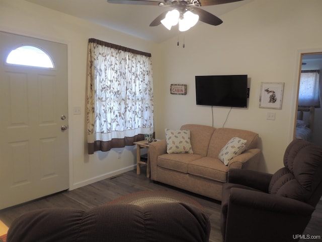 8653 Ll Rd, Rapid River, MI 49878 - living area with ceiling fan, wood finished floors, and baseboards