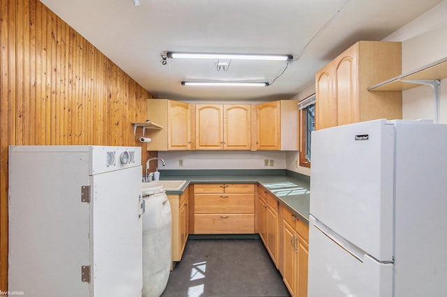 2758 Military St, Port Huron, MI 48060 - kitchen featuring freestanding refrigerator, light brown cabinetry, wooden walls, concrete floors, and a sink