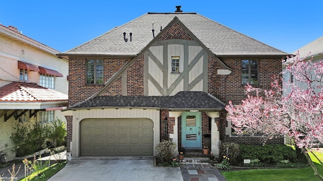 2758 Military St, Port Huron, MI 48060 - view of front of house featuring brick siding, a garage, concrete driveway, and a shingled roof