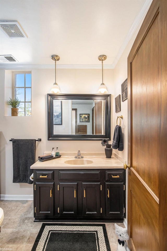 2758 Military St, Port Huron, MI 48060 - bathroom featuring vanity, ornamental molding, and baseboards