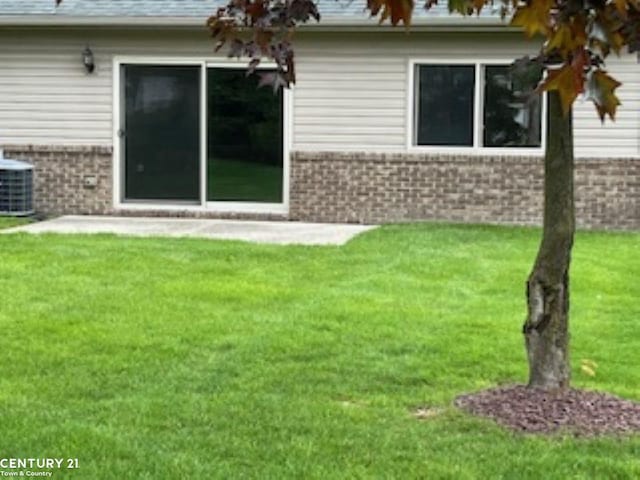 35301 White Birch Unit 1Bldg 1, Clinton Township, MI 48035 - back of house with brick siding, a lawn, and central air condition unit