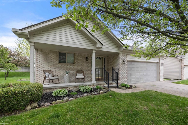 view of front of property with covered porch, an attached garage, concrete driveway, a front yard, and brick siding