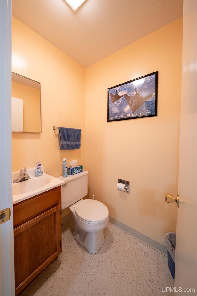 405 Mustang St, Gwinn, MI 49841 - bathroom with toilet, vanity, and baseboards