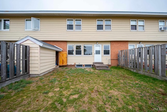 405 Mustang St, Gwinn, MI 49841 - back of house with brick siding and cooling unit
