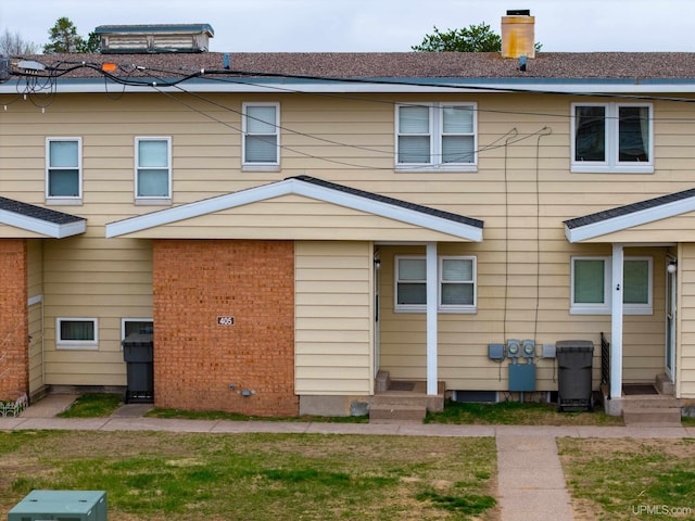 405 Mustang St, Gwinn, MI 49841 - rear view of house featuring a chimney