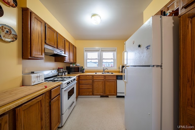 405 Mustang St, Gwinn, MI 49841 - kitchen with white appliances, under cabinet range hood, a sink, and brown cabinets