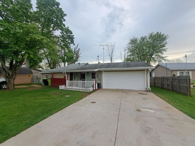 ranch-style home featuring a porch, an attached garage, and driveway