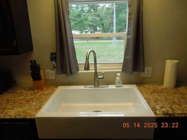 1582 Oakwood St, Gladwin, MI 48624 - kitchen view of a sink and dark cabinetry