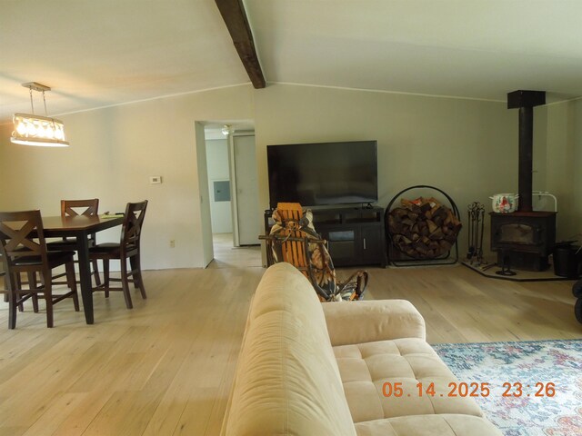 1582 Oakwood St, Gladwin, MI 48624 - living room with wood finished floors and a wood stove