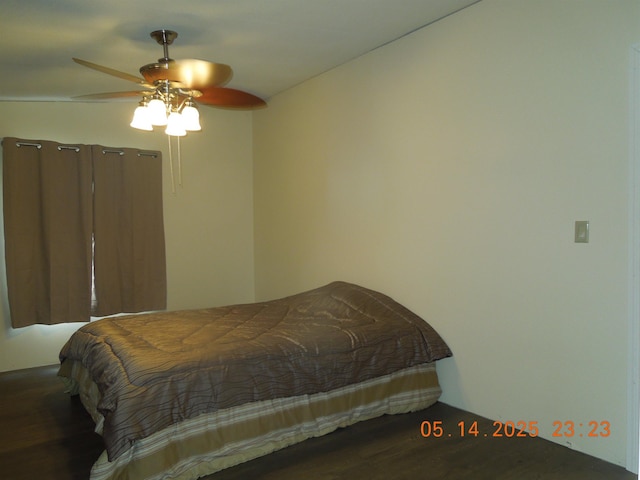 1582 Oakwood St, Gladwin, MI 48624 - bedroom with wood finished floors and a ceiling fan