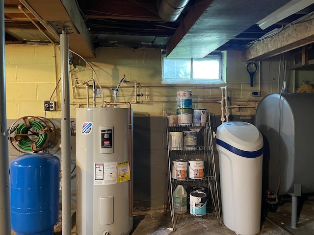 utility room with water heater and oil tank