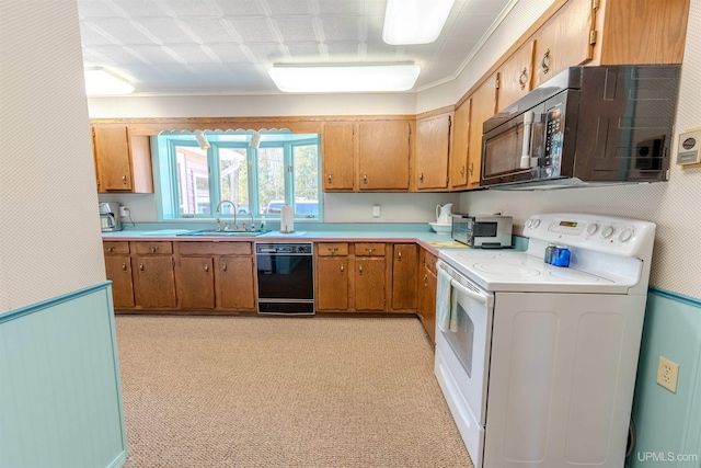 536 N W Gulliver Lake Rd, Gulliver, MI 49840 - kitchen featuring black appliances, light countertops, brown cabinetry, and a sink