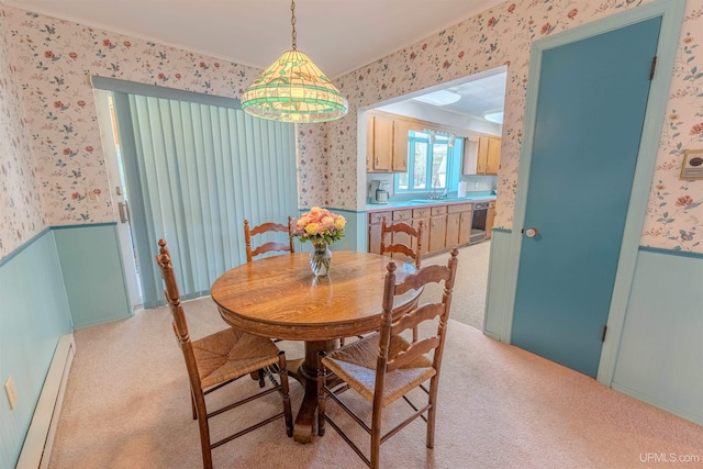 536 N W Gulliver Lake Rd, Gulliver, MI 49840 - dining area with wallpapered walls, baseboard heating, a wainscoted wall, and light carpet