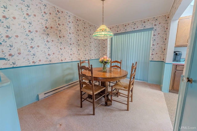 536 N W Gulliver Lake Rd, Gulliver, MI 49840 - dining space with wallpapered walls, a baseboard heating unit, a wainscoted wall, ornamental molding, and light colored carpet