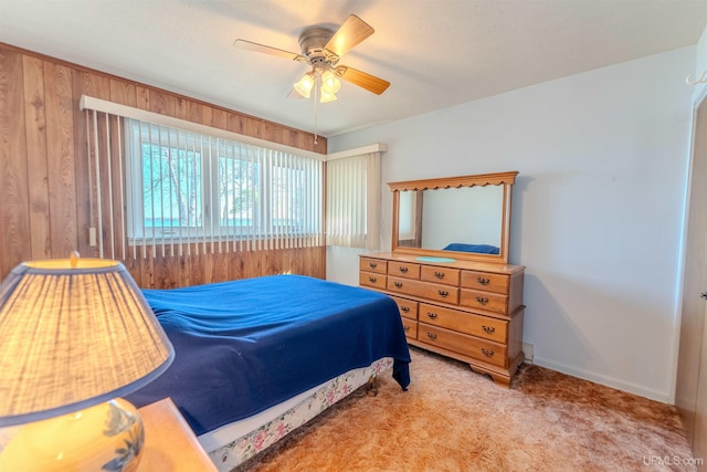 536 N W Gulliver Lake Rd, Gulliver, MI 49840 - bedroom featuring carpet flooring, wooden walls, and ceiling fan