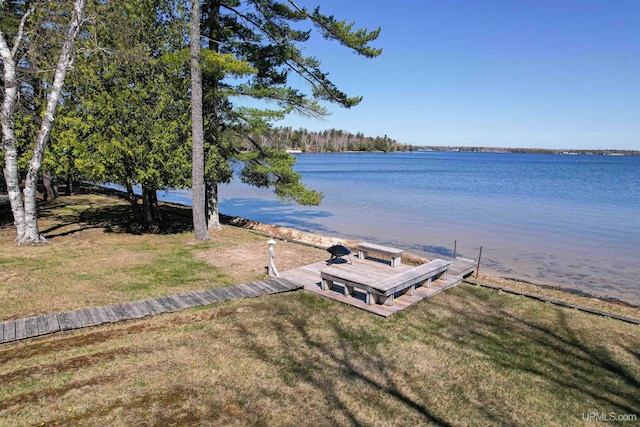 536 N W Gulliver Lake Rd, Gulliver, MI 49840 - view of green lawn featuring a dock and a water view