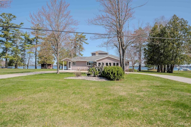 536 N W Gulliver Lake Rd, Gulliver, MI 49840 - view of front of house featuring concrete driveway and a front yard
