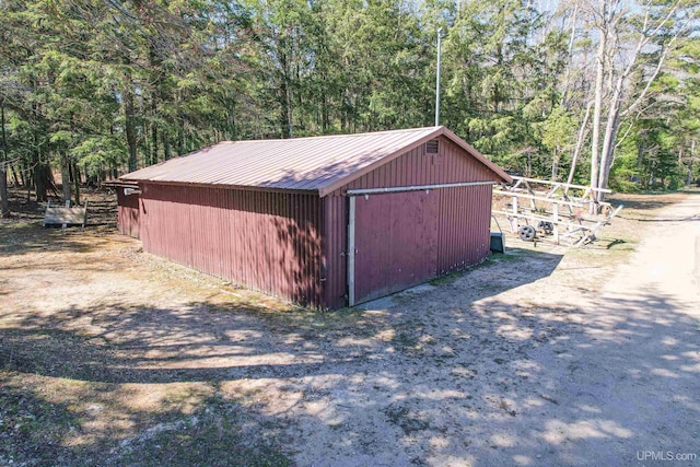 536 N W Gulliver Lake Rd, Gulliver, MI 49840 - view of outbuilding featuring an outdoor structure and a forest view
