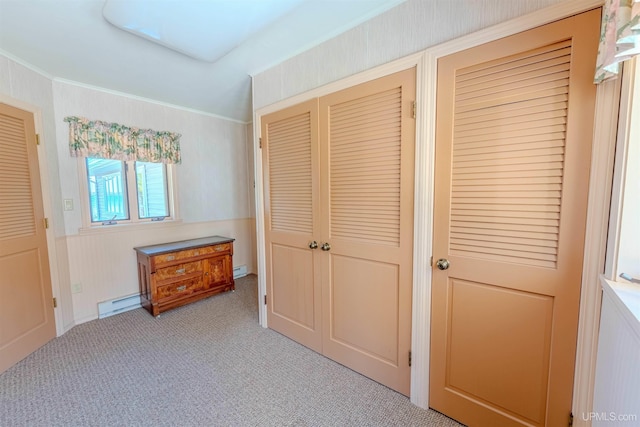536 N W Gulliver Lake Rd, Gulliver, MI 49840 - unfurnished bedroom featuring light colored carpet, a baseboard radiator, and crown molding