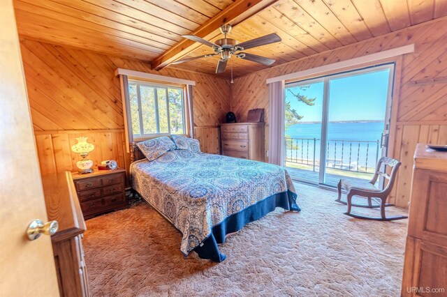 536 N W Gulliver Lake Rd, Gulliver, MI 49840 - carpeted bedroom with wood ceiling, wood walls, access to exterior, beamed ceiling, and a water view