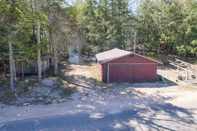 536 N W Gulliver Lake Rd, Gulliver, MI 49840 - view of outbuilding with an outdoor structure and a view of trees