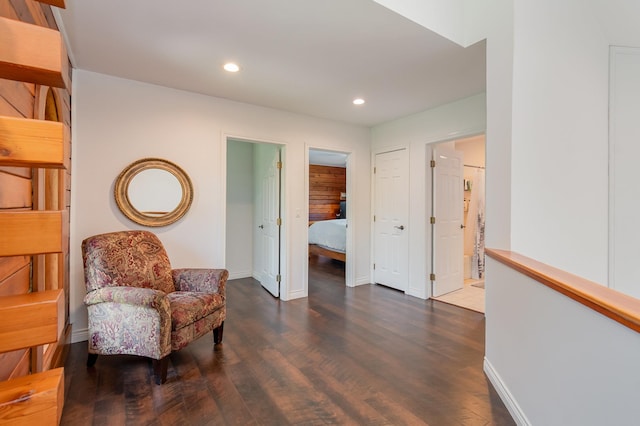 sitting room featuring wood finished floors, recessed lighting, and baseboards