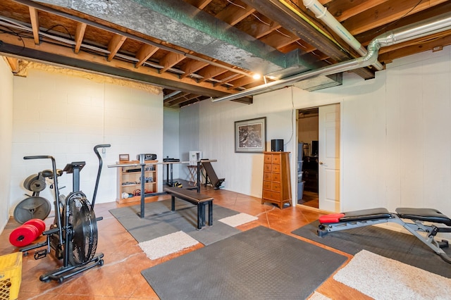 exercise room featuring tile patterned flooring