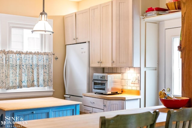 1117 Lakepointe St, Grosse Pointe Park, MI 48230 - kitchen featuring freestanding refrigerator, decorative light fixtures, and butcher block countertops