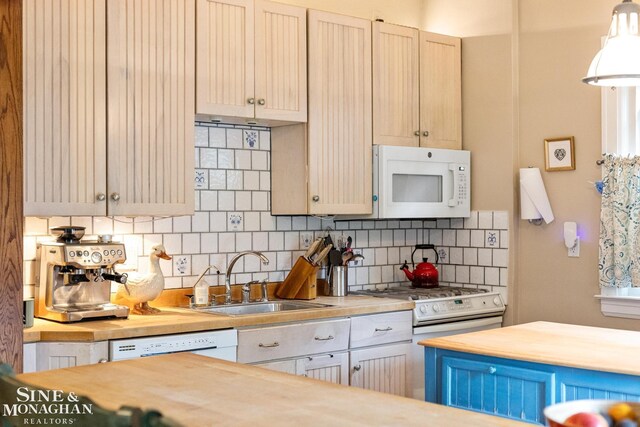 1117 Lakepointe St, Grosse Pointe Park, MI 48230 - kitchen with white appliances, a sink, backsplash, wooden counters, and pendant lighting