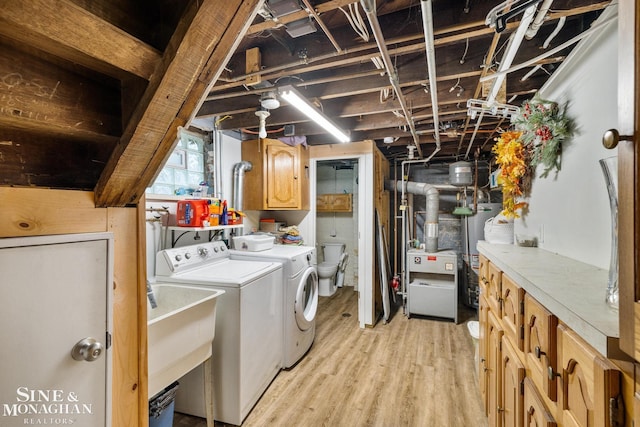 1117 Lakepointe St, Grosse Pointe Park, MI 48230 - washroom featuring washer and clothes dryer, cabinet space, water heater, and light wood-style flooring