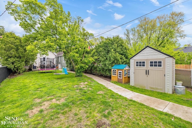 1117 Lakepointe St, Grosse Pointe Park, MI 48230 - view of yard with a shed, a trampoline, and an outdoor structure