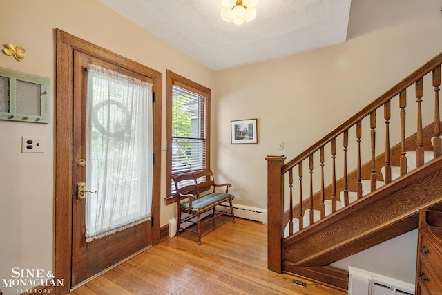 1117 Lakepointe St, Grosse Pointe Park, MI 48230 - entrance foyer featuring stairs, light wood-type flooring, a baseboard heating unit, and baseboards